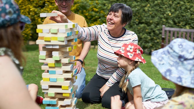 Family playing jenga at Wentworth Castle Gardens